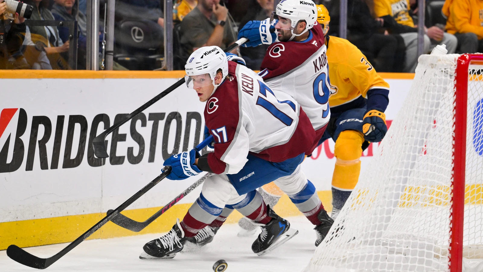 File photo: Colorado Avalanche skaters pursue the puck behind the net against the Nashville Predators at Bridgestone Arena.