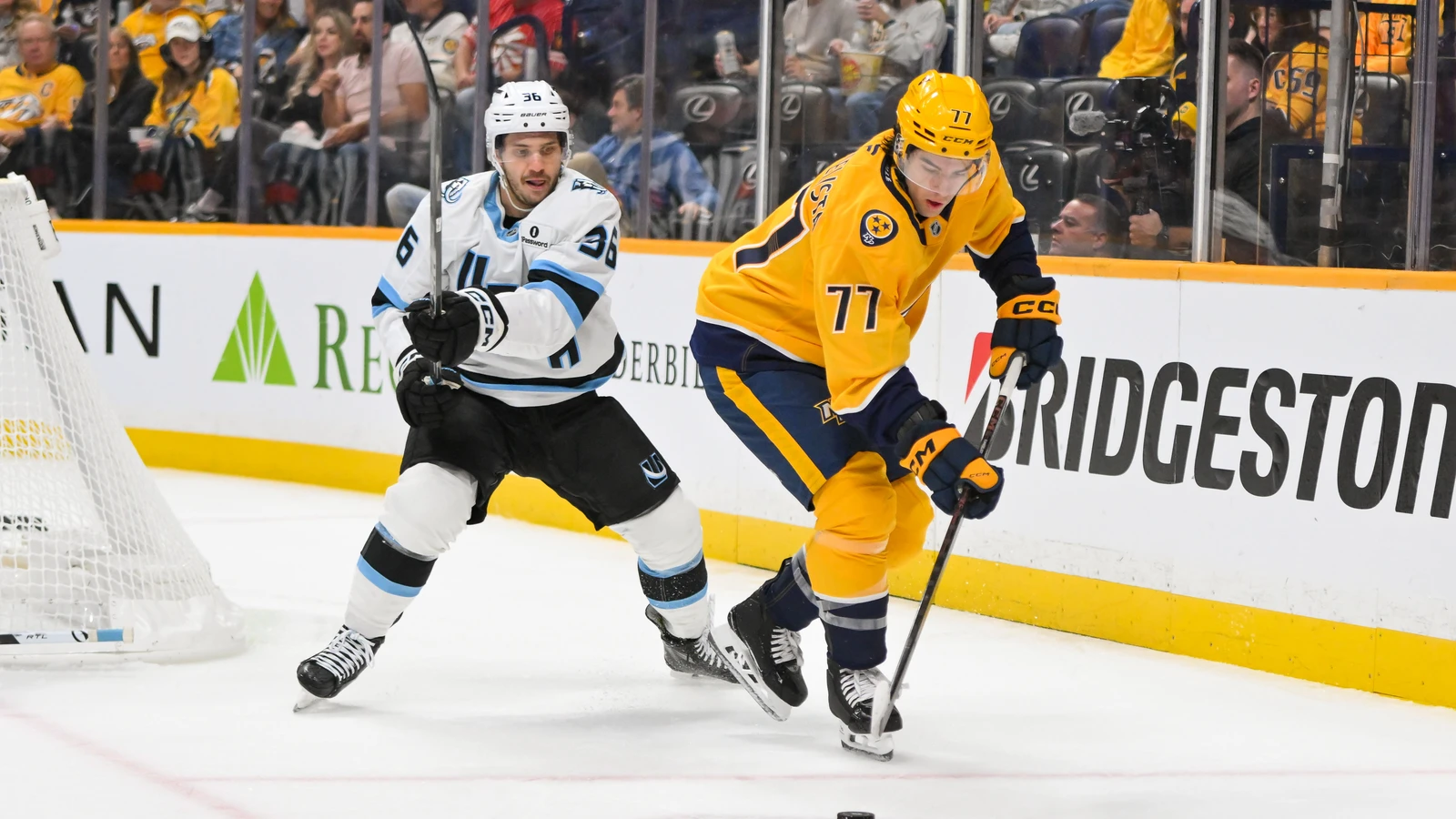 Andrew Agozzino skates for Utah behind Nashville's Luke Evangelista on October 11, 2025. File photo.