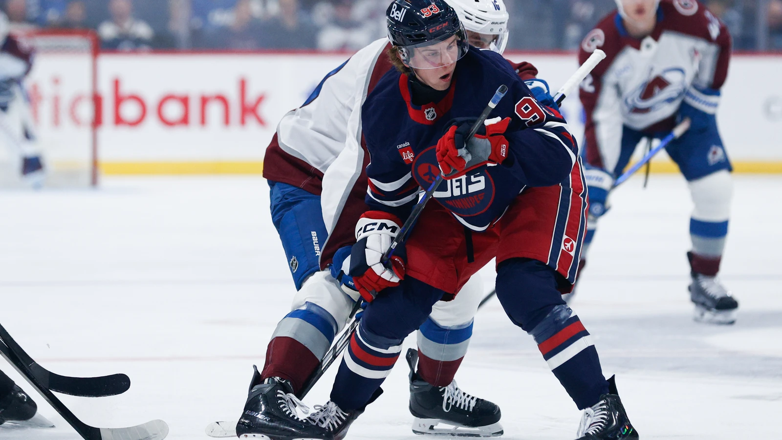 File photo: Colorado Avalanche forward Taylor Makar jostles for position behind Winnipeg Jets forward Brad Lambert at Canada Life Centre.