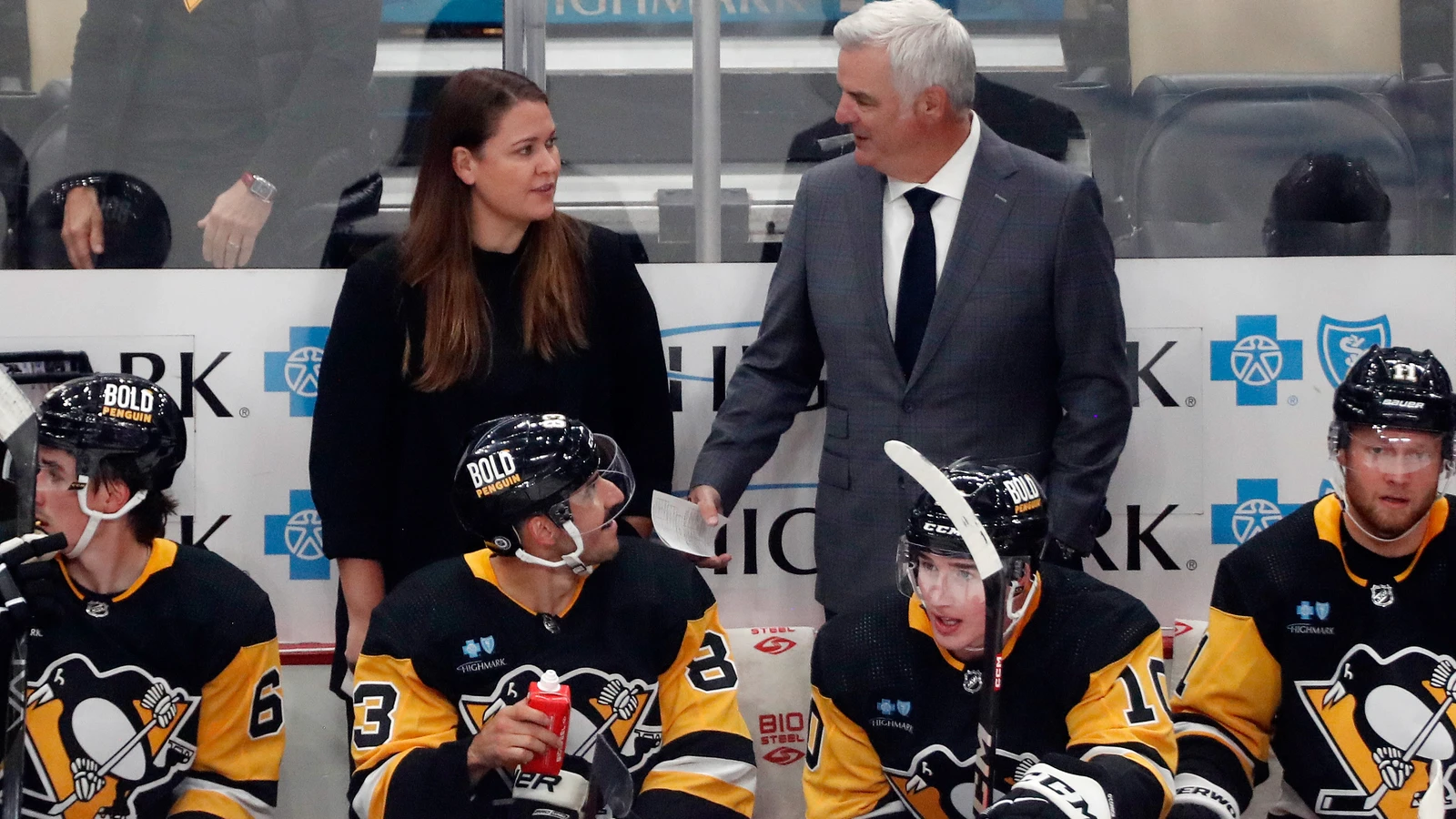 PWHL Montreal head coach Kori Cheverie, left, works behind the Pittsburgh Penguins bench during a 2023 preseason game. File photo.