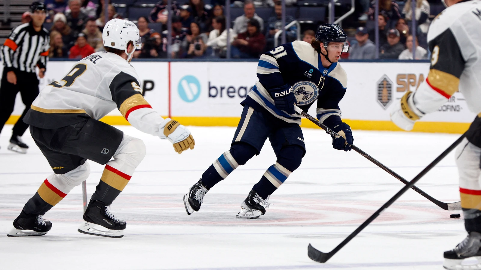 File photo: Columbus Blue Jackets centre Kent Johnson skates with the puck against the Vegas Golden Knights.