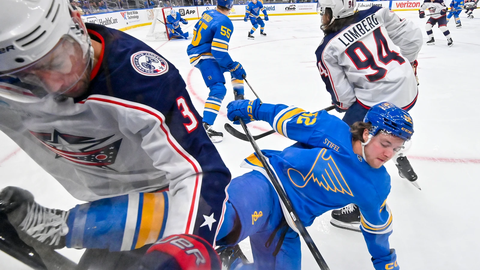 File photo: St. Louis Blues centre Zach Dean is checked along the boards during a game against the Columbus Blue Jackets.