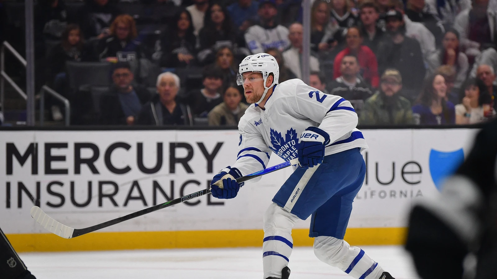File photo: Brandon Carlo shoots the puck while playing for the Toronto Maple Leafs at Crypto.com Arena.