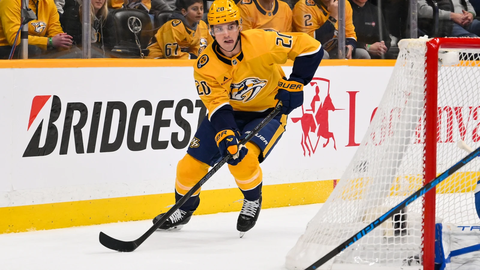 File photo: Justin Barron, wearing a Nashville Predators jersey, skates with the puck against the St. Louis Blues on Feb. 2, 2026.