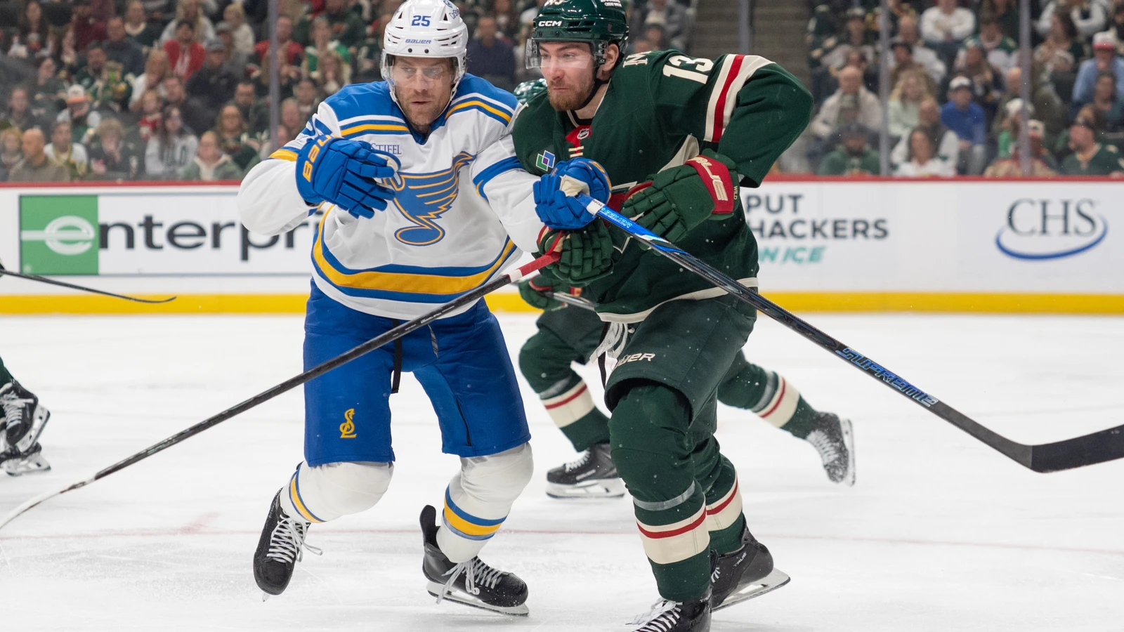 File photo: St. Louis Blues defenceman Brandon Carlo and Minnesota Wild centre Yakov Trenin collide during a game at Grand Casino Arena.