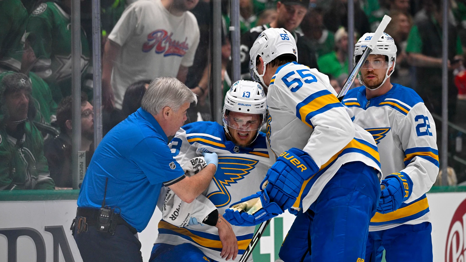 Alexey Toropchenko is helped off the ice during the second period against the Dallas Stars at American Airlines Center.