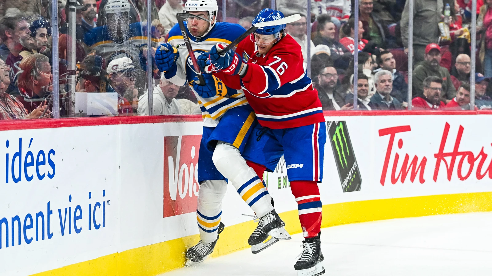Montreal Canadiens winger Zachary Bolduc checks a Buffalo Sabres defenceman against the boards at Bell Centre.