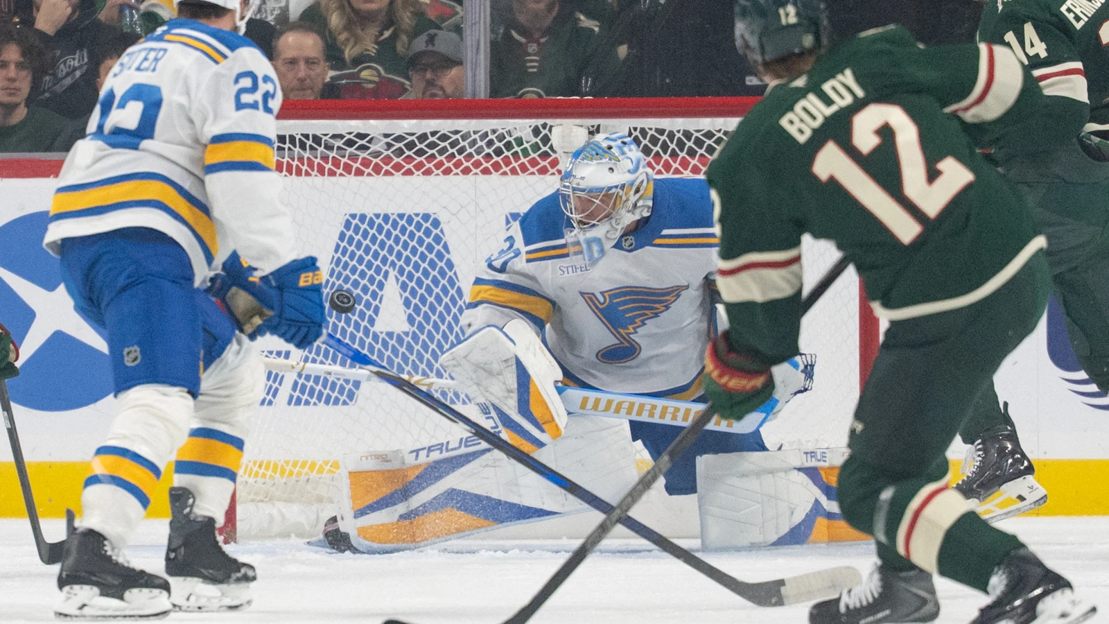 Matt Boldy shoots against St. Louis Blues goaltender Joel Hofer at Grand Casino Arena.