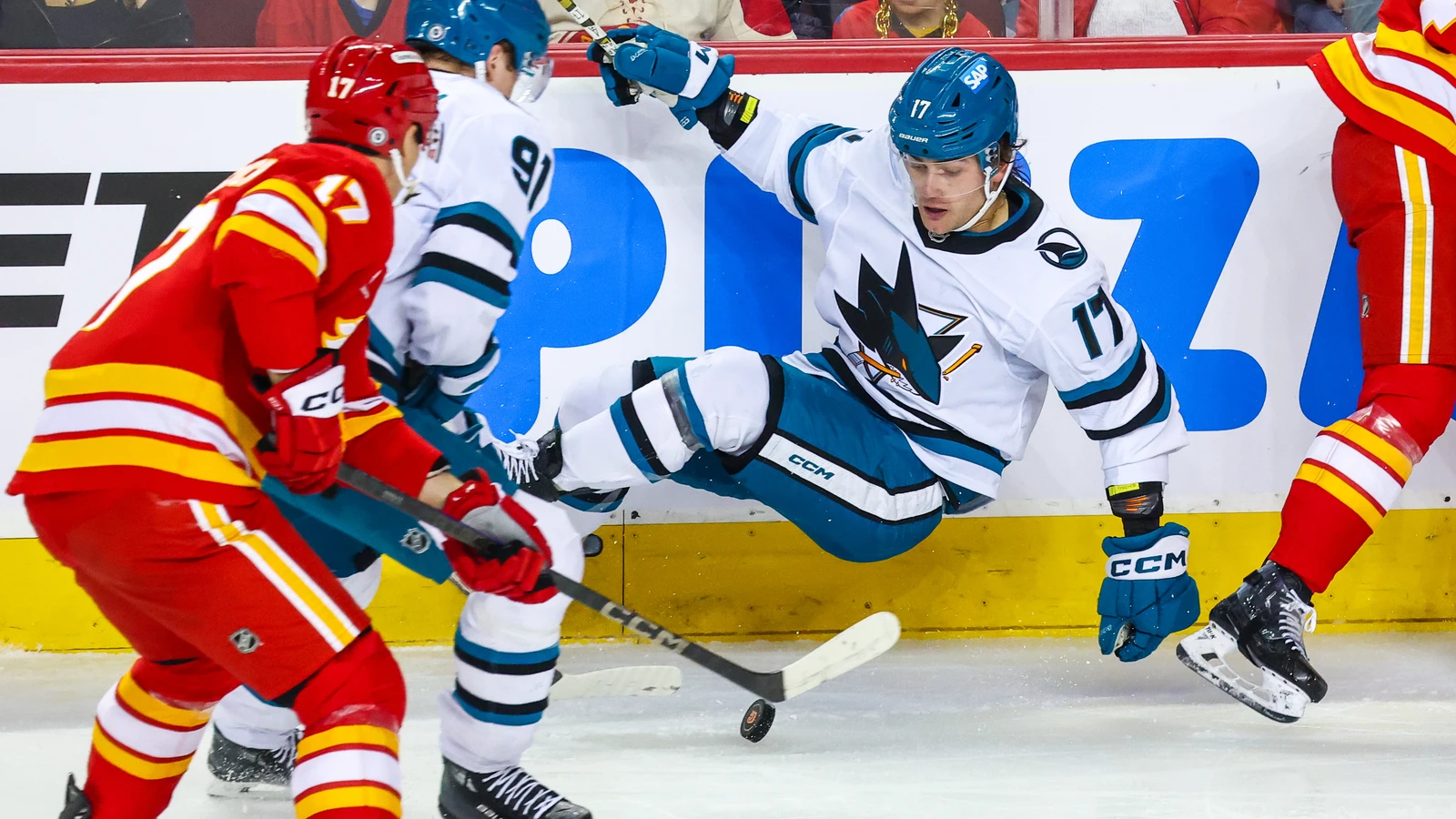 Thomas Bordeleau battles for the puck with San Jose against Calgary on April 13, 2025. File photo.
