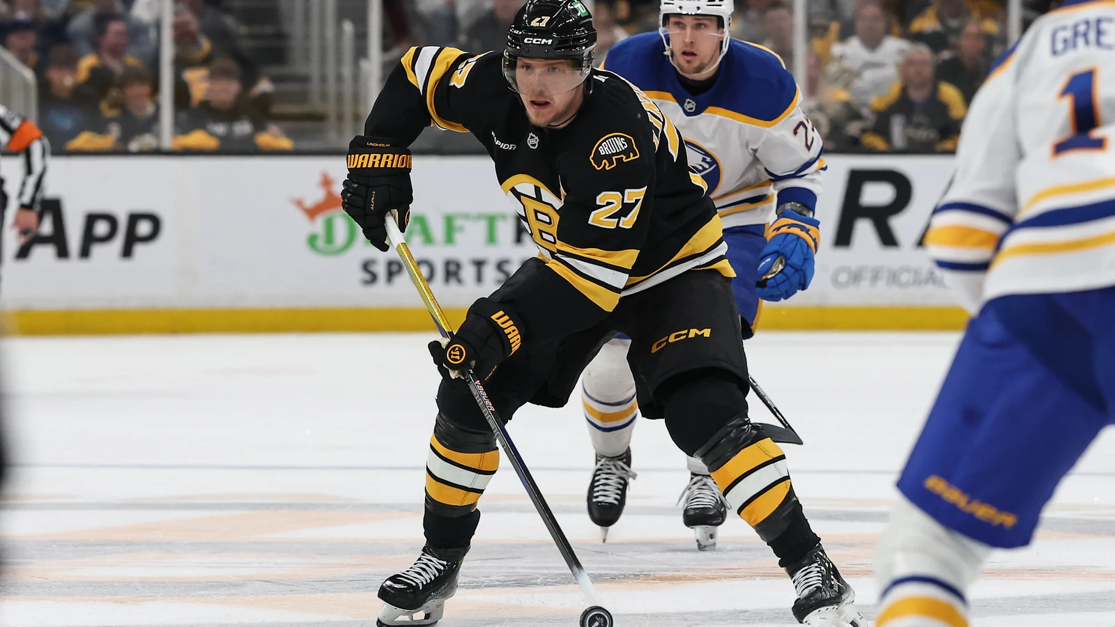Boston Bruins defenseman Hampus Lindholm carries the puck against the Buffalo Sabres in May 2026. File photo.