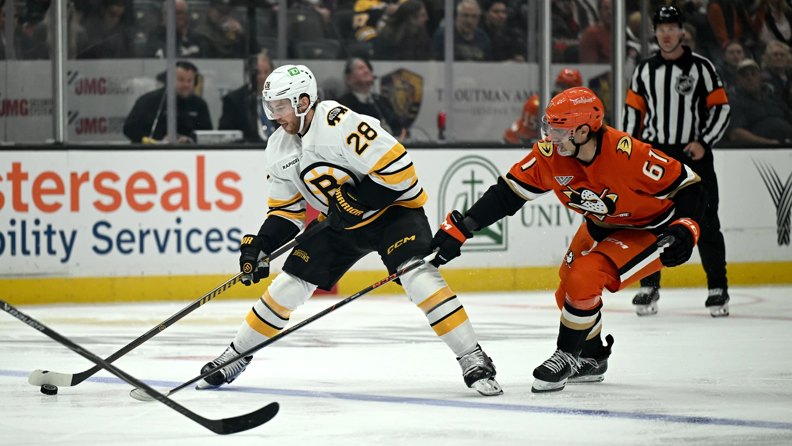 Boston Bruins centre Elias Lindholm skates with the puck against the Anaheim Ducks at Honda Center.