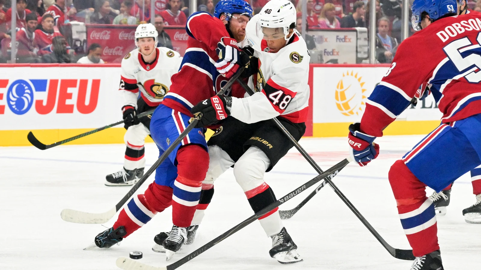 Montreal Canadiens defenceman Mike Matheson battles Ottawa Senators forward Jaxon Cover for the puck during a September 26, 2026 preseason game in Montreal.