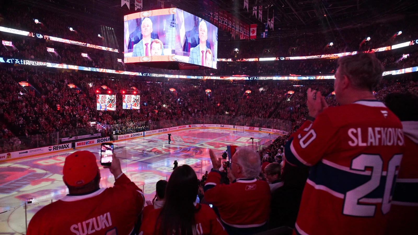 File photo: Canadiens fans in red jerseys applaud during pre-game introductions at the Bell Centre in Montreal.