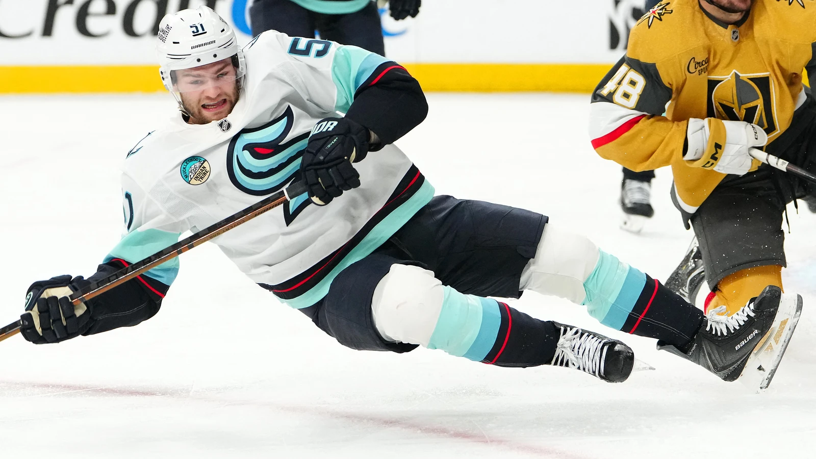 Shane Wright is tripped while skating for Seattle against Vegas on April 15, 2026. File photo.
