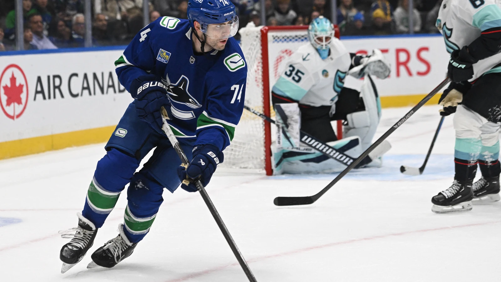 File photo: Jake DeBrusk skates with the puck for the Vancouver Canucks against the Seattle Kraken on Sept. 26, 2026.