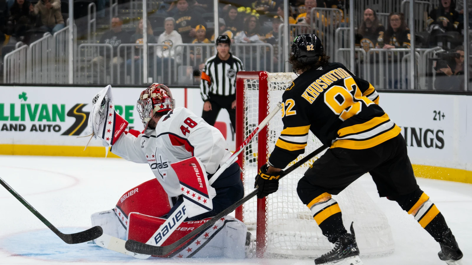 File photo: Washington Capitals goaltender Logan Thompson catches the puck during a game at TD Garden.