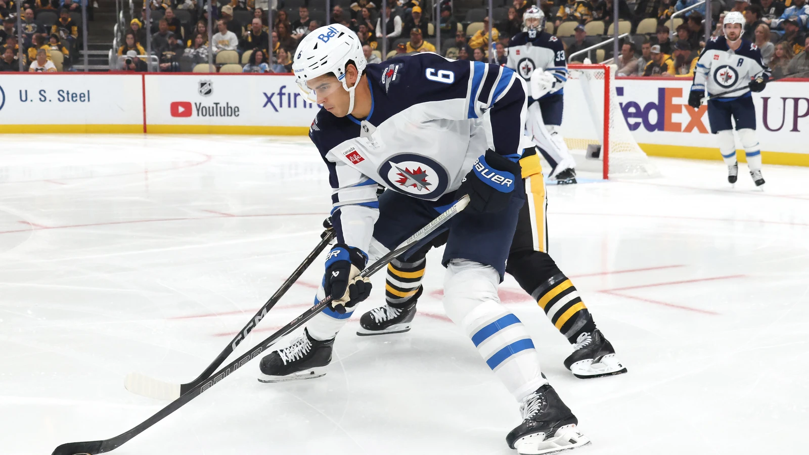 File photo: Winnipeg Jets defenceman Jack St. Ivany controls the puck against the Pittsburgh Penguins.