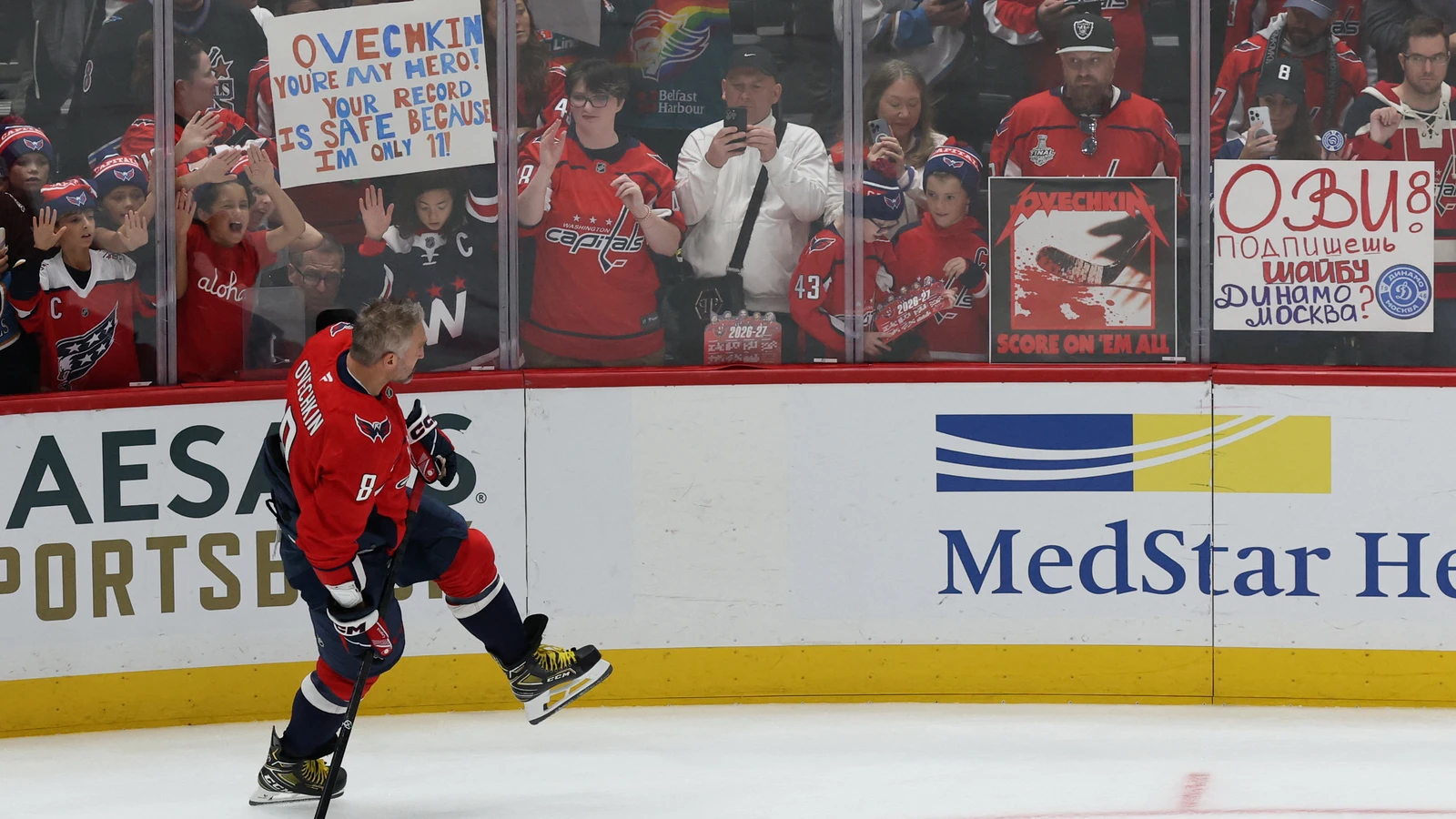 Alex Ovechkin skates during warmups as Capitals fans watch from behind the glass at Capital One Arena.