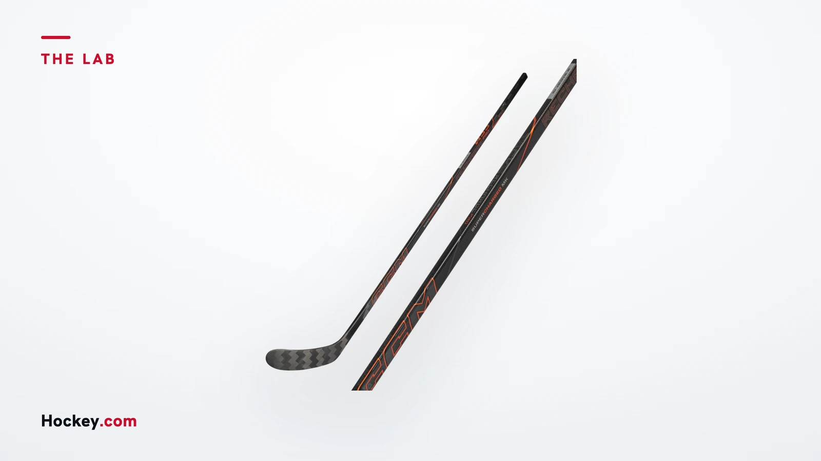 Black CCM Tacks Recharge Pro hockey stick with orange graphics and a close-up of its shaft