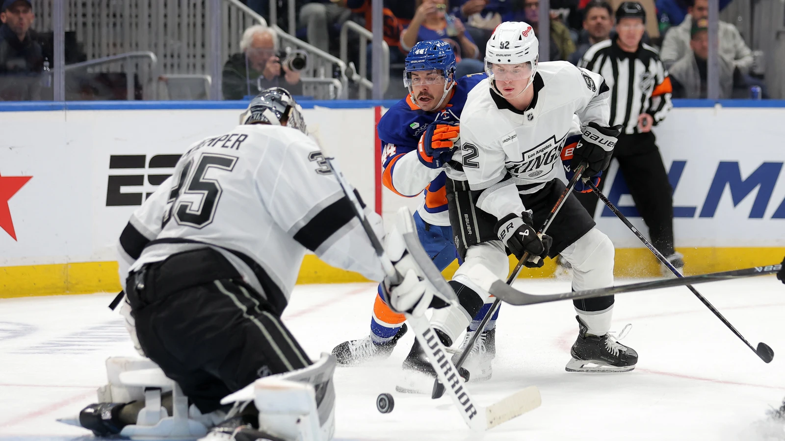 Brandt Clarke battles for position in front of Darcy Kuemper during the Kings game against the Islanders at UBS Arena.