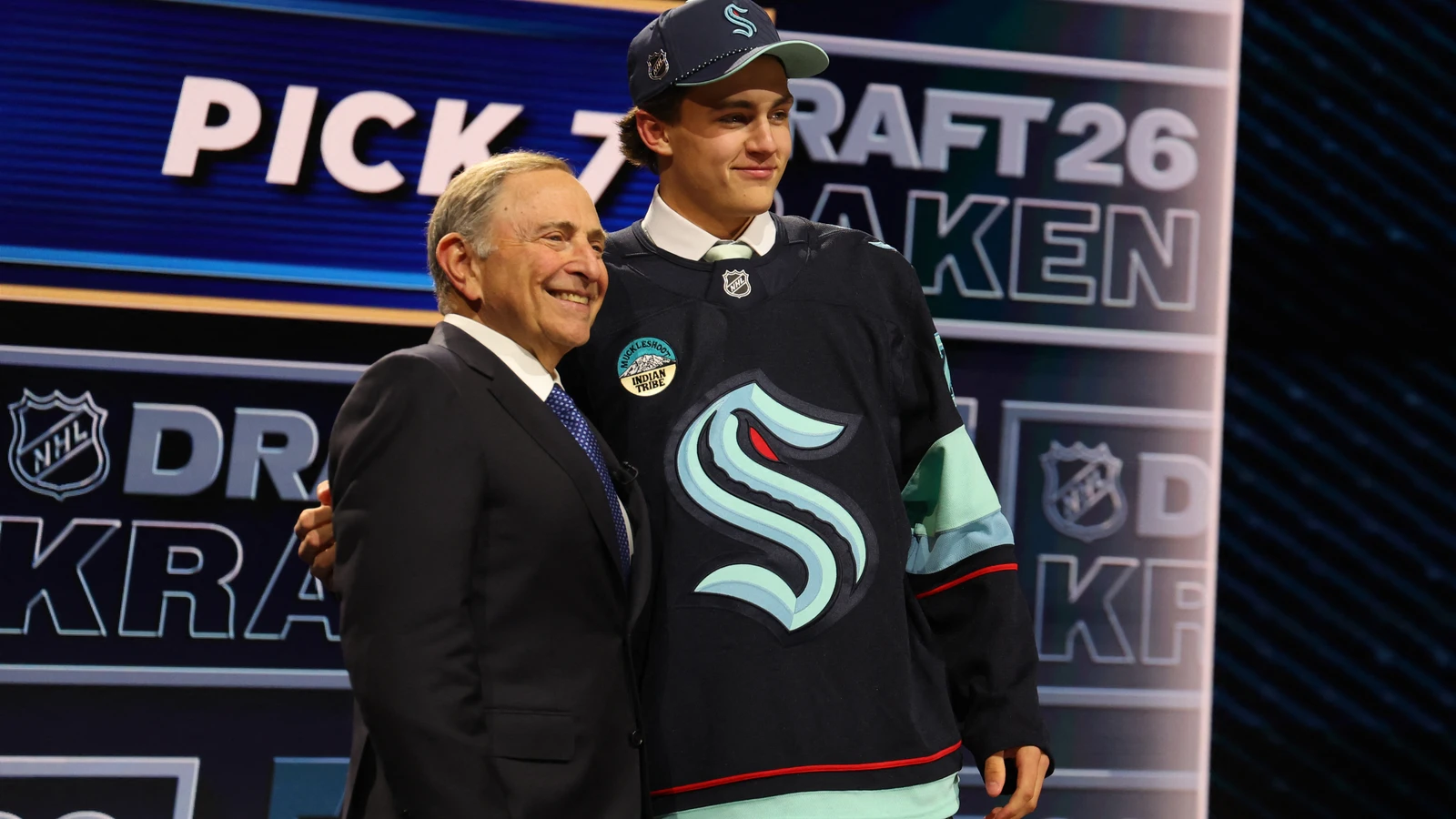 Seattle Kraken first-round pick Chase Reid poses with NHL commissioner Gary Bettman at the 2026 NHL Draft on June 26, 2026. File photo.
