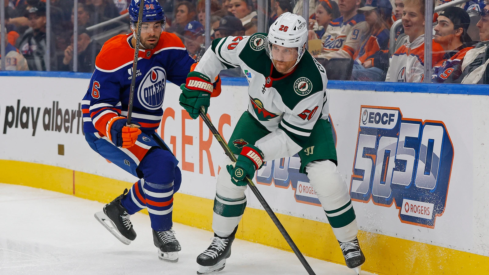 File photo: Wild forward Blake Coleman looks to pass in front of Oilers defenceman Ryan Shea at Rogers Place in Edmonton.