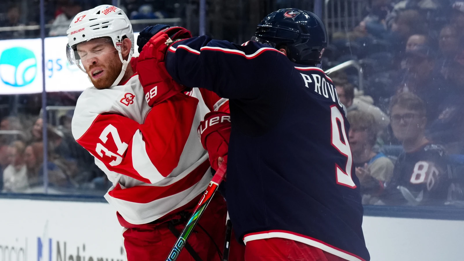 File photo: Detroit Red Wings forward J.T. Compher jostles with Columbus Blue Jackets defenceman Ivan Provorov during a stoppage.