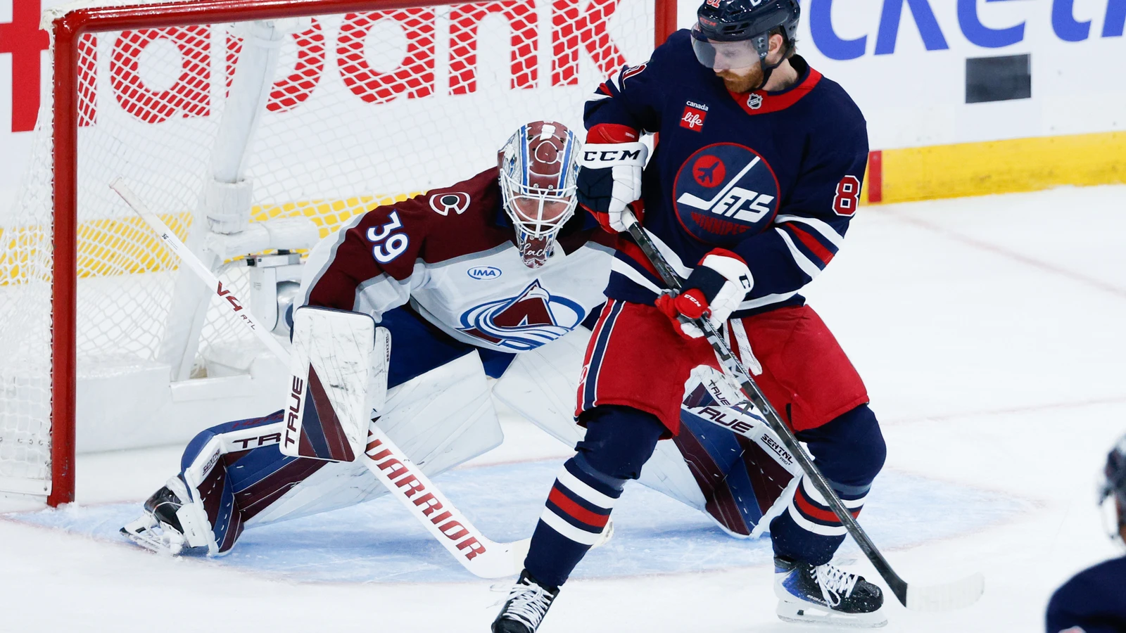 File photo: Winnipeg Jets forward Kyle Connor looks for the puck beside Colorado Avalanche goaltender Mackenzie Blackwood at Canada Life Centre.