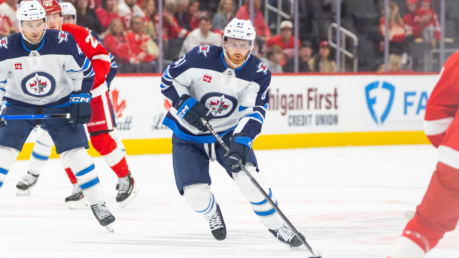 Kyle Connor handles the puck for the Winnipeg Jets against the Detroit Red Wings at Little Caesars Arena.
