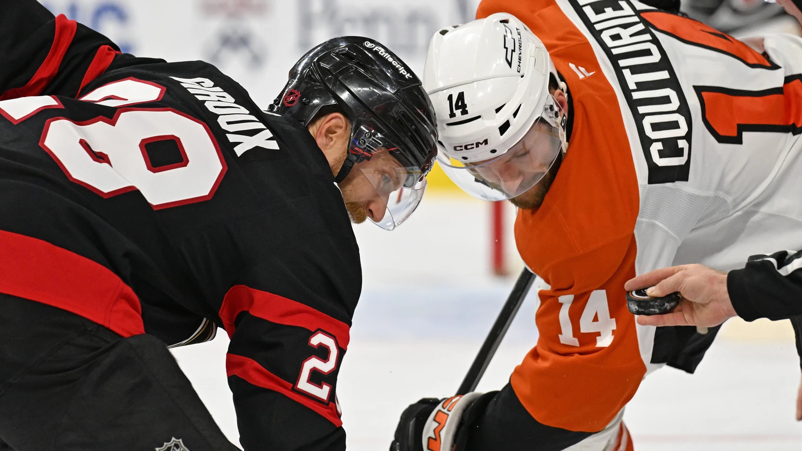 File photo: Philadelphia Flyers centre Sean Couturier takes a faceoff against Ottawa Senators forward Claude Giroux at Xfinity Mobile Arena.