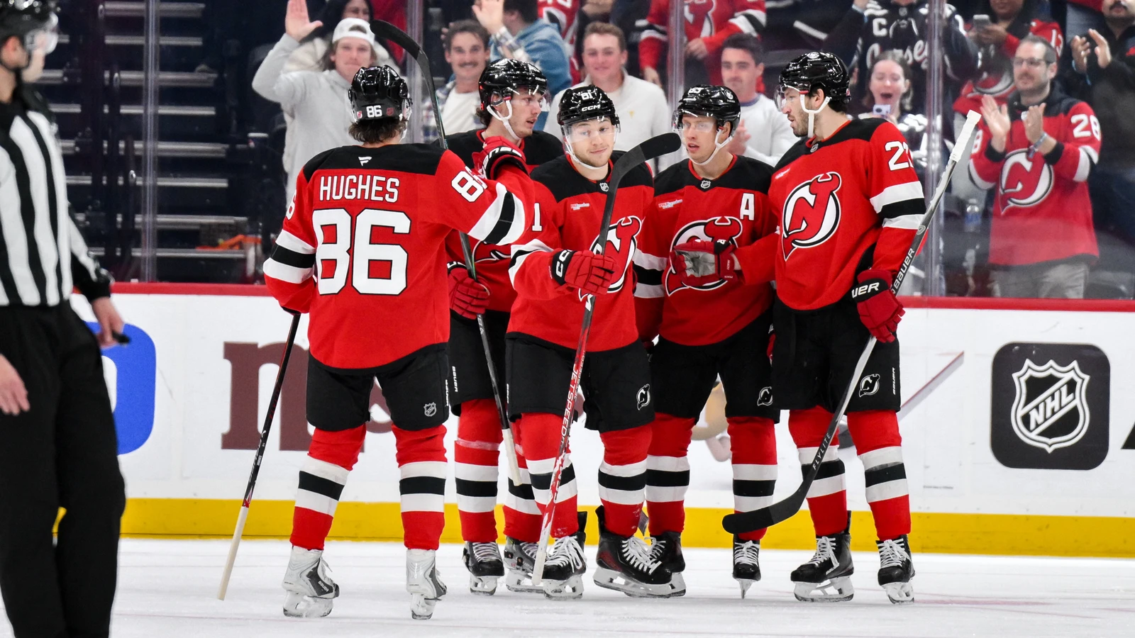 Arseny Gritsyuk celebrates with New Jersey Devils teammates after scoring against the Anaheim Ducks at Prudential Center.