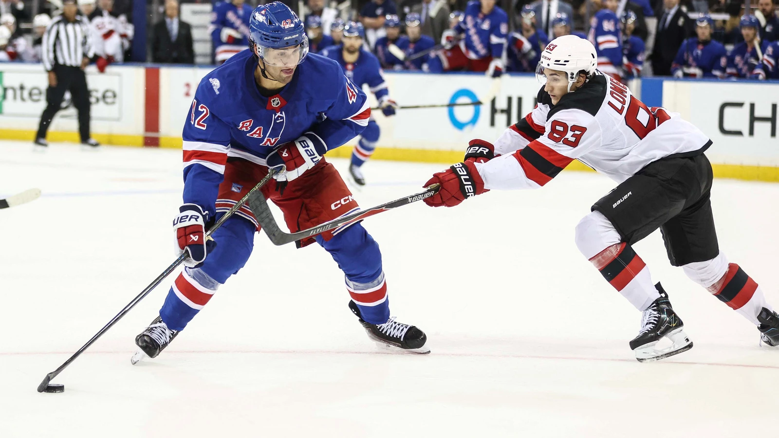 File photo: New Jersey Devils forward Amadeus Lombardi battles New York Rangers centre Noah Laba for the puck in overtime of a preseason game at Madison Square Garden on Sept. 24, 2026.