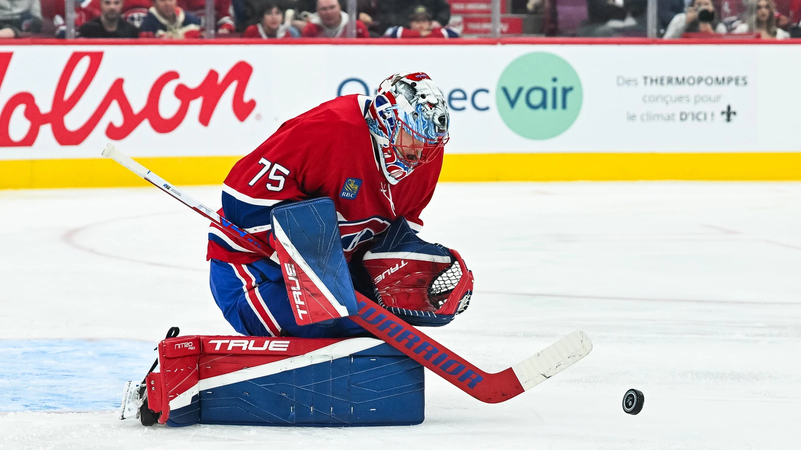 Jakub Dobes makes a save for the Montréal Canadiens against the San Jose Sharks at Bell Centre.