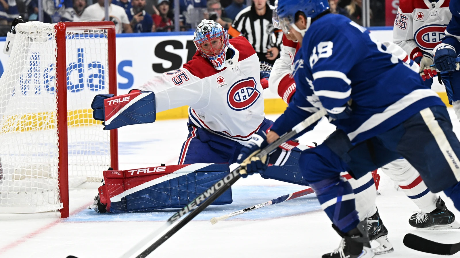 File photo: Montreal Canadiens goaltender Jakub Dobes stretches to block a shot from Toronto Maple Leafs forward William Nylander at Scotiabank Arena on Sept. 29, 2026.