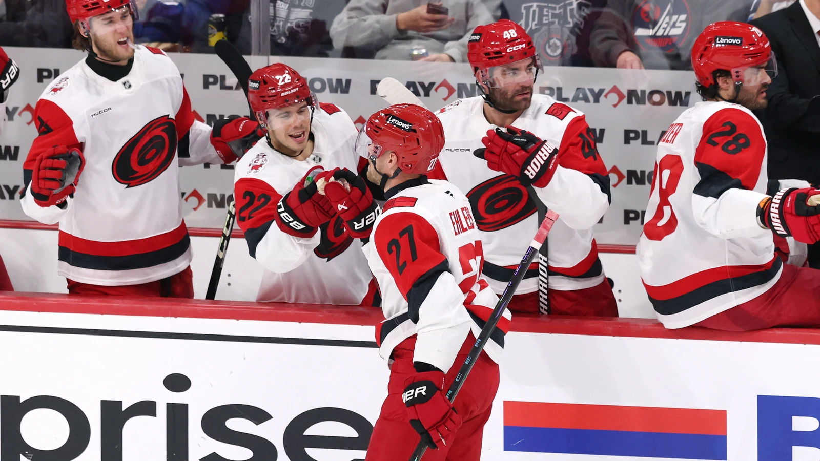 Carolina Hurricanes forward Nikolaj Ehlers celebrates with teammates at the bench after scoring against the Winnipeg Jets at Canada Life Centre.