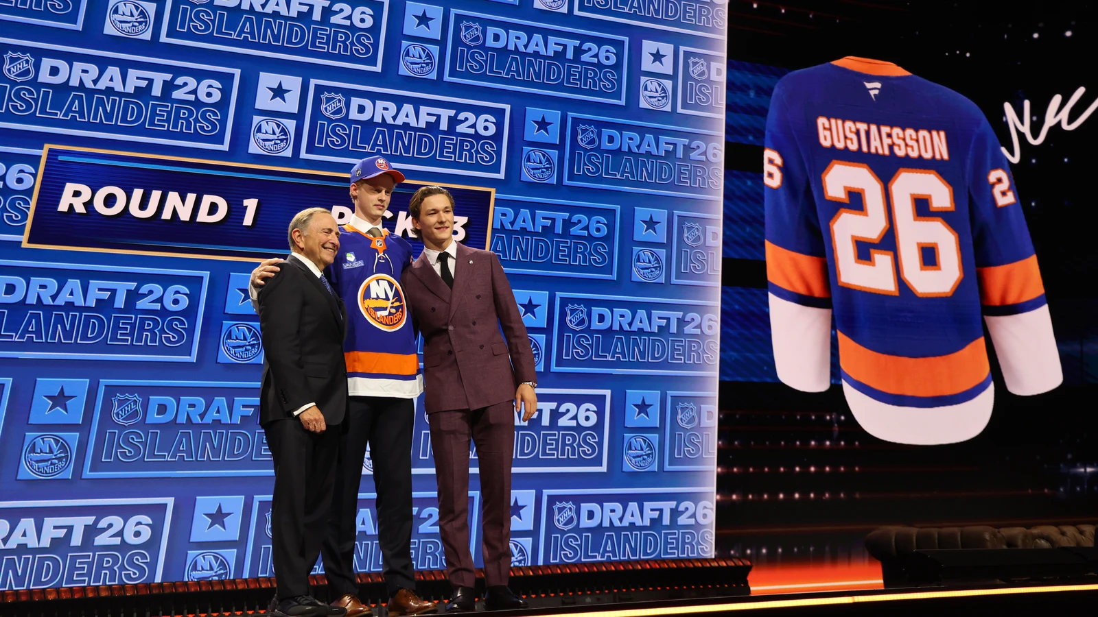 Malte Gustafsson stands with Gary Bettman and Matthew Schaefer after the Islanders select him in the first round of the 2026 NHL Draft. File photo; Cole Eiserman is not pictured.