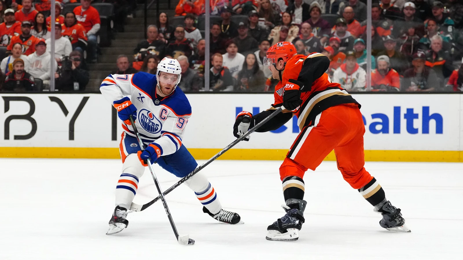 Connor McDavid battles Radko Gudas for the puck in Anaheim on April 30, 2026. File photo.
