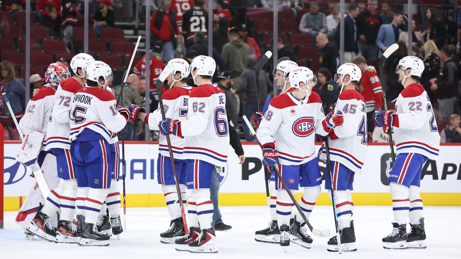 File photo: Montreal Canadiens players celebrate a win on the ice at the United Center in Chicago.