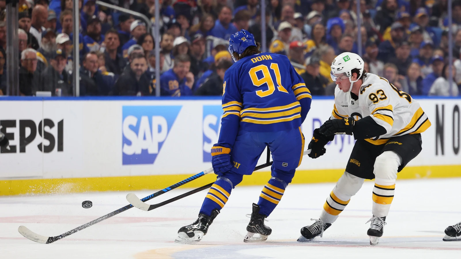 Fraser Minten plays the puck against Buffalo during the 2026 playoffs. File photo.
