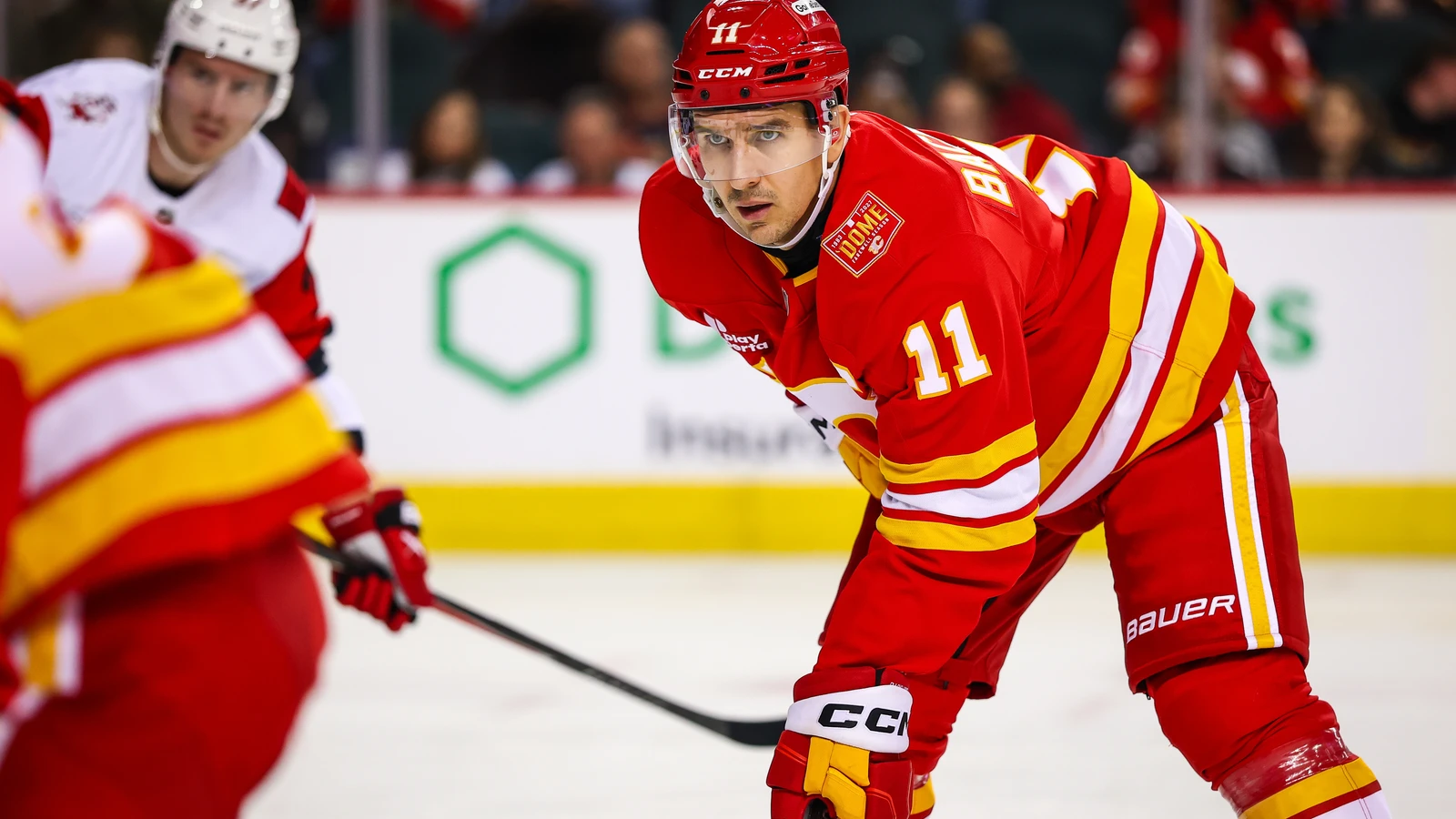 File photo: Calgary Flames centre Mikael Backlund prepares for a faceoff against the Carolina Hurricanes at Scotiabank Saddledome.