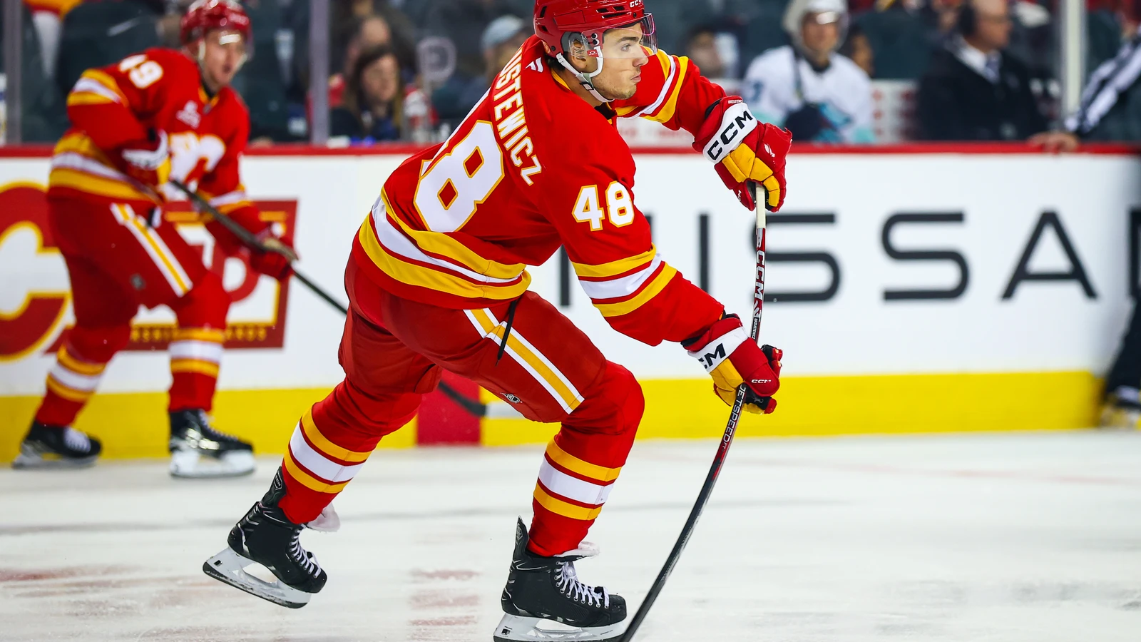 File photo: Calgary Flames defenceman Hunter Brzustewicz skates with the puck against the Seattle Kraken on September 20, 2026.