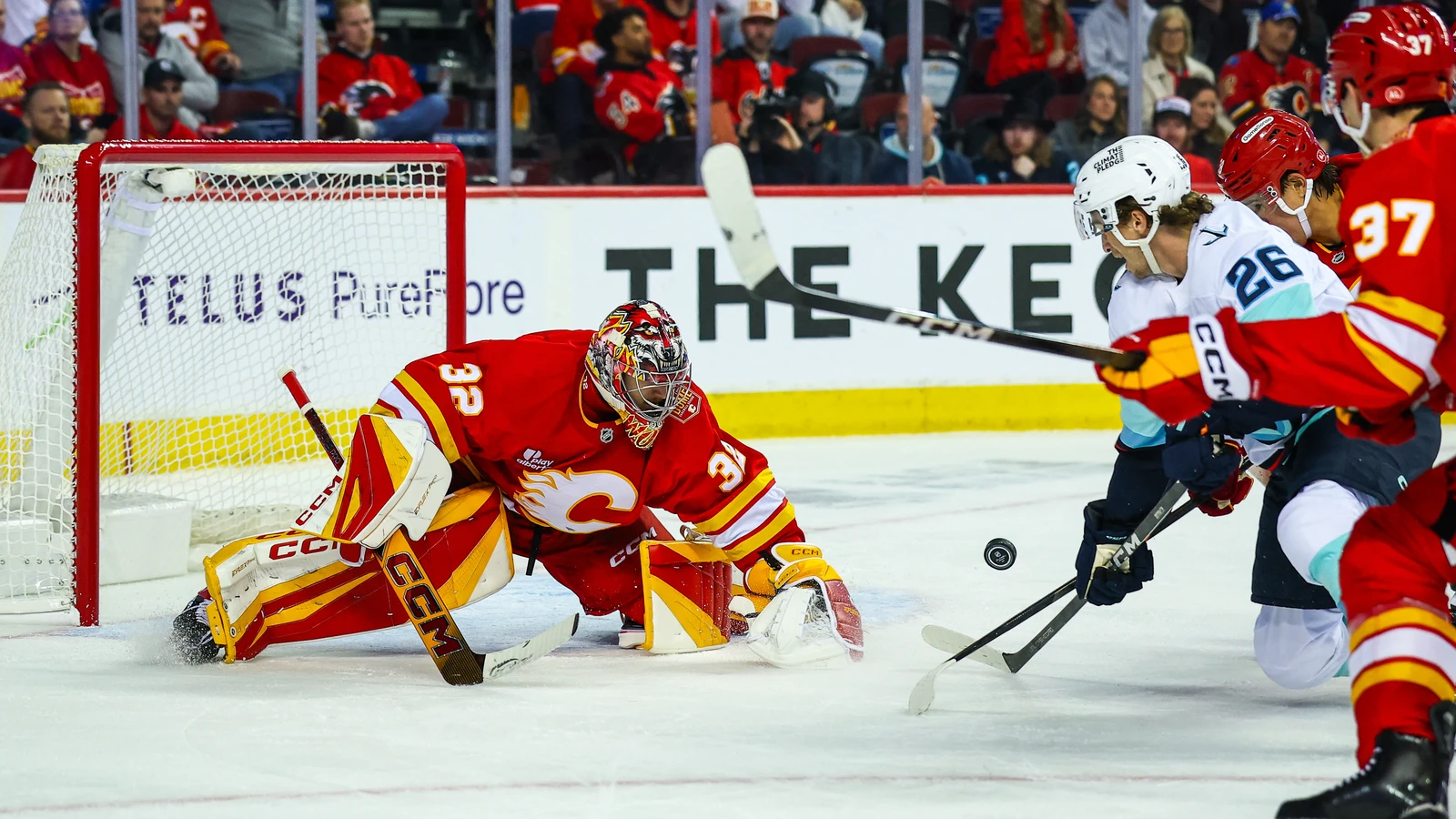 File photo: Calgary Flames goaltender Dustin Wolf makes a save against the Seattle Kraken at Scotiabank Saddledome.