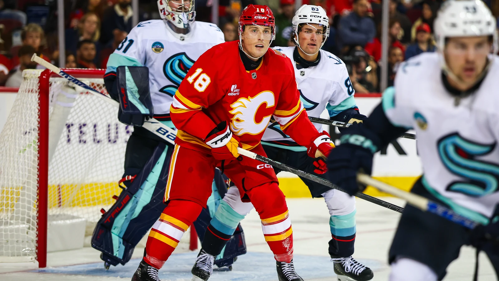 File photo: Calgary Flames centre Ben Jones screens Seattle Kraken goaltender Philipp Grubauer at Scotiabank Saddledome.