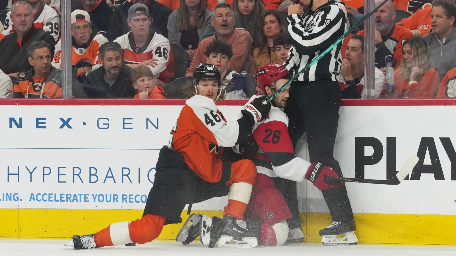 Trevor Zegras checks Sean Walker for Philadelphia against Carolina on May 9, 2026. File photo.