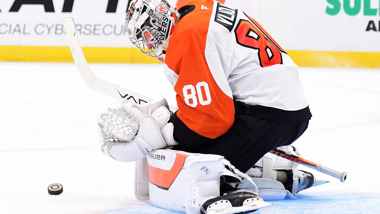 Philadelphia Flyers goaltender Dan Vladar makes a save against the Boston Bruins at TD Garden.