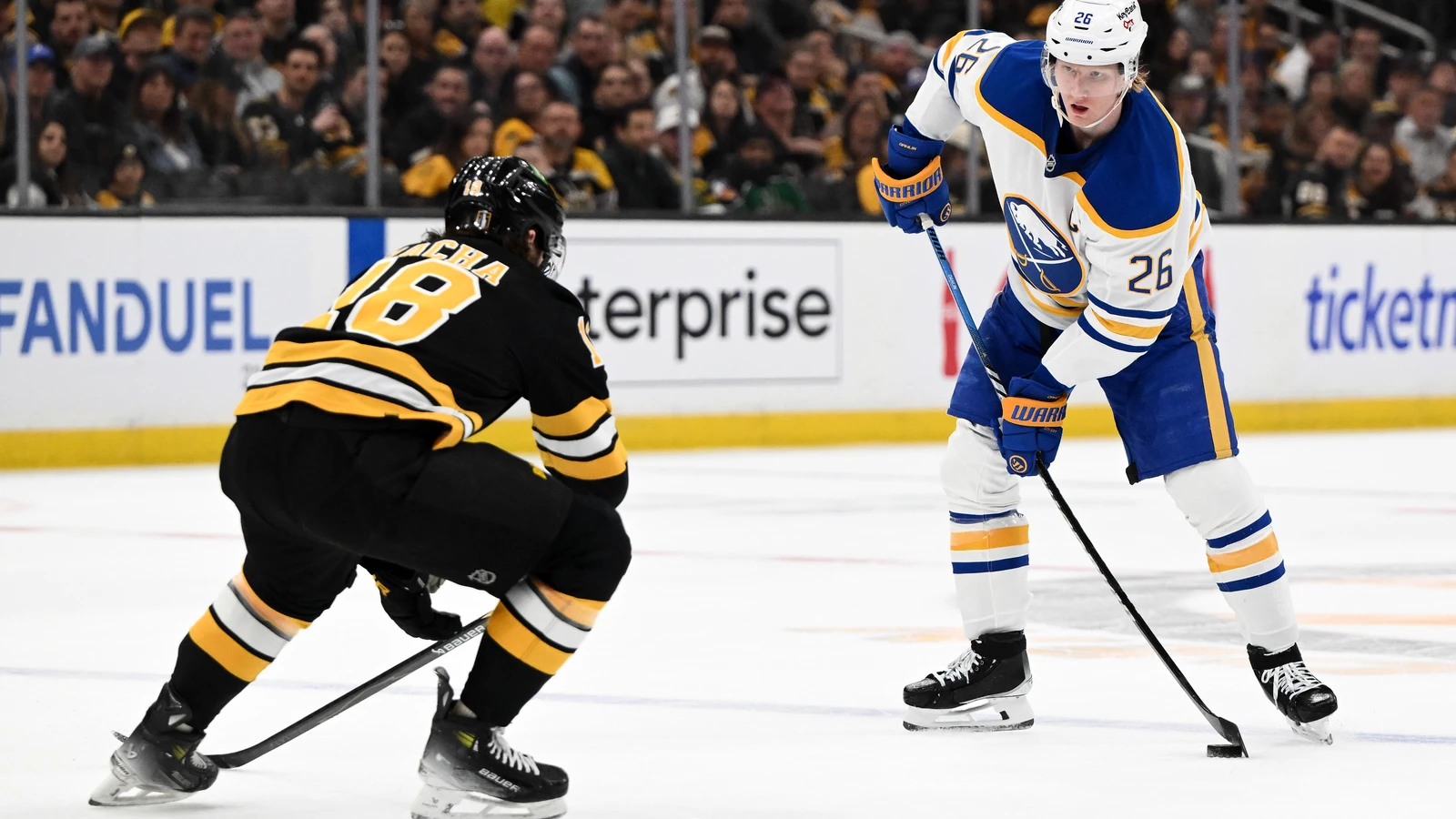 Rasmus Dahlin skates against Pavel Zacha during the 2026 playoffs. File photo.