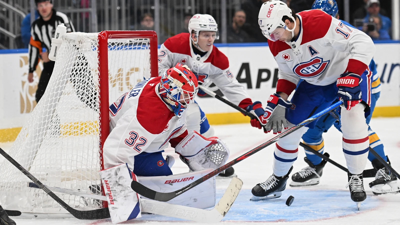 Jacob Fowler makes a save for the Montreal Canadiens against the St. Louis Blues at Enterprise Center.