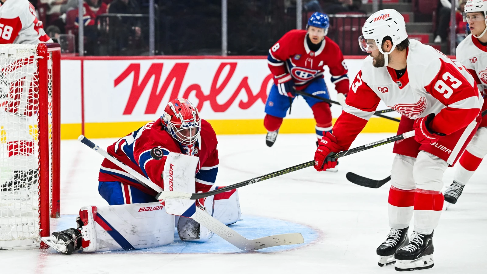 Jacob Fowler makes a save for the Montreal Canadiens against the Detroit Red Wings at Bell Centre.