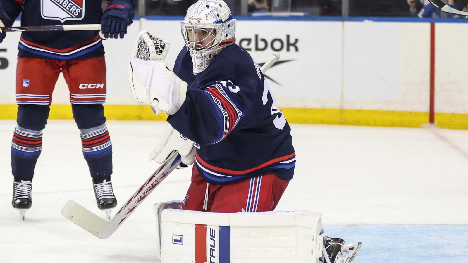 New York Rangers goaltender Dylan Garand makes a glove save against the Vancouver Canucks at Madison Square Garden.