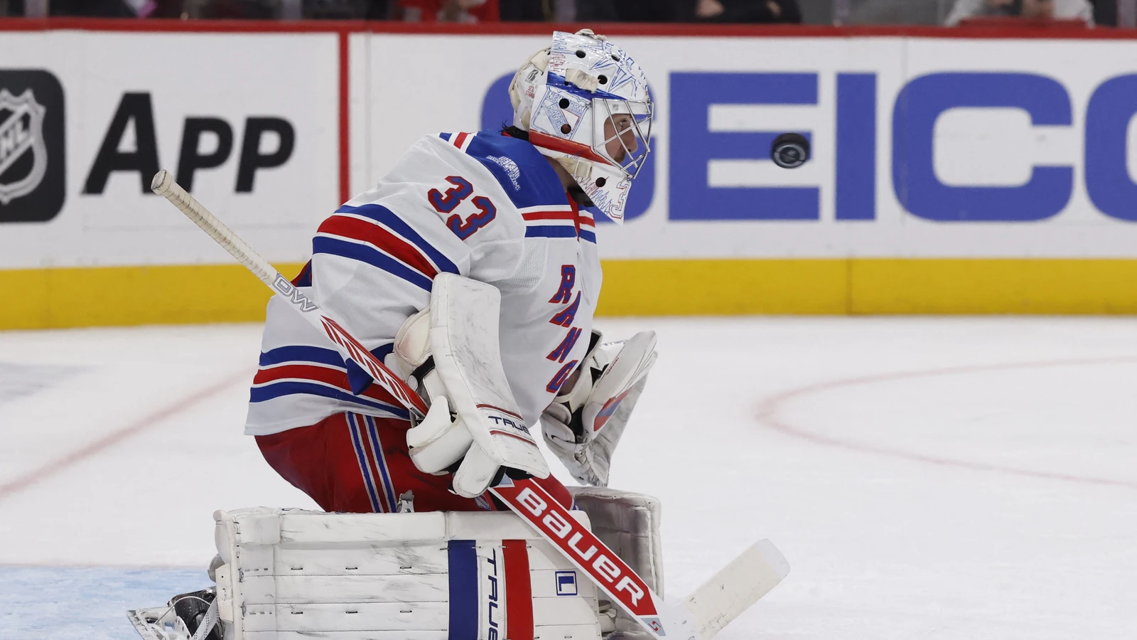 New York Rangers goalie Dylan Garand makes a save against the Detroit Red Wings at Little Caesars Arena.